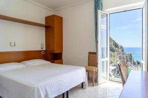 Posteľ alebo postele v izbe v ubytovaní Hotel Bellavista