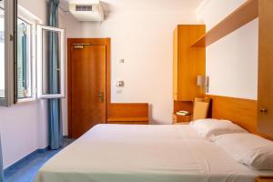 Posteľ alebo postele v izbe v ubytovaní Hotel Bellavista