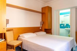 Posteľ alebo postele v izbe v ubytovaní Hotel Bellavista