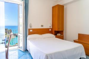 Posteľ alebo postele v izbe v ubytovaní Hotel Bellavista