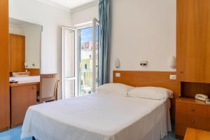 Posteľ alebo postele v izbe v ubytovaní Hotel Bellavista