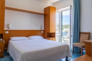Posteľ alebo postele v izbe v ubytovaní Hotel Bellavista