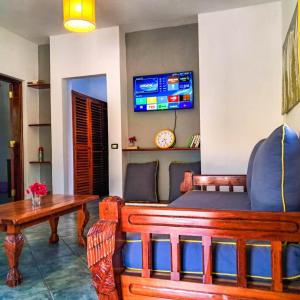 a living room with a couch and a table at Modern Girasoli Suites 01 in Malindi +20 photos