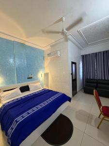 Postel nebo postele na pokoji v ubytování HOTEL MAVILLA Cotonou
