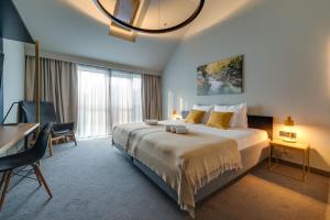 Posteľ alebo postele v izbe v ubytovaní Lyra Hotel Plitvice