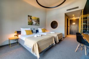 Posteľ alebo postele v izbe v ubytovaní Lyra Hotel Plitvice