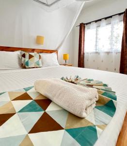 Postel nebo postele na pokoji v ubytování Papillon Garden Bar Villas
