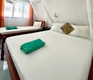 Postel nebo postele na pokoji v ubytování Papillon Garden Bar Villas