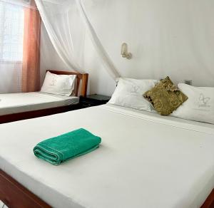 Postel nebo postele na pokoji v ubytování Papillon Garden Bar Villas