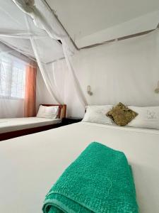 Postel nebo postele na pokoji v ubytování Papillon Garden Bar Villas