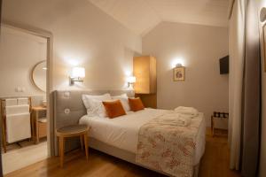 a hotel room with a bed and a mirror at Casa da Fonte de Cima in Celorico de Basto +115 photos