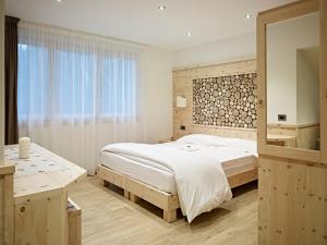 Ένα ή περισσότερα κρεβάτια σε δωμάτιο στο B&B Augusto