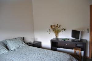 Uma cama ou camas num quarto em Casa dos Hospitalrios