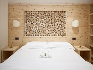 Ένα ή περισσότερα κρεβάτια σε δωμάτιο στο B&B Augusto