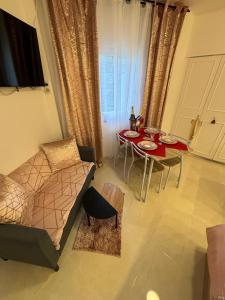 a living room with a couch and a table at Brooklyn Studio Rose in Sanary-sur-Mer +32 photos