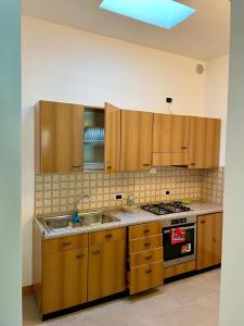 Kuchyň nebo kuchyňský kout v ubytování Idro Appartamenti - Vantone