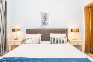 Cama ou camas em um quarto em The View – Santo António Villas, Golf & Spa