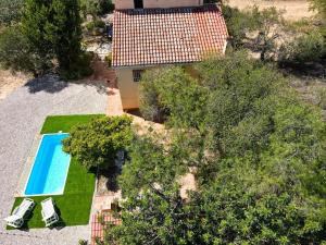 an overhead view of a house with a swimming pool and trees at La Noguera by Unik Vacation in Valls