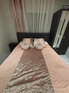 a bed with two pillows on top of it at Willy coccon d'amour in Sanary-sur-Mer +31 photos