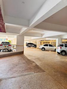 a parking garage with cars parked in it at Cozy Homes in Nairobi