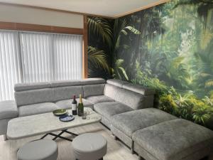 Posezení v ubytování Yokkaichi Guest House