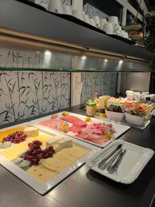 a kitchen with some food on a counter at Globotel Hotel Garbsen in Garbsen +18 photos