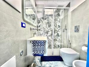 a bathroom with a shower and a toilet and a sink at Linea1 Amalfi Coast 500 Mt Beach in Maiori +10 photos