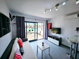 TV a/nebo společenská místnost v ubytování Casa Acuario