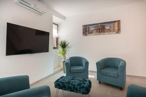 TV a/nebo společenská místnost v ubytování Le Dimore della Custodia