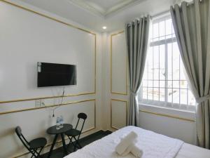 TV a/nebo společenská místnost v ubytování Ngọc Châu Hotel