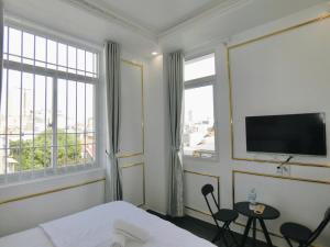 TV a/nebo společenská místnost v ubytování Ngọc Châu Hotel