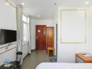 TV a/nebo společenská místnost v ubytování Ngọc Châu Hotel