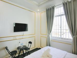 TV a/nebo společenská místnost v ubytování Ngọc Châu Hotel