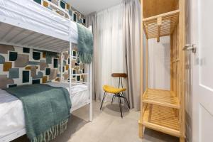 Postel nebo postele na pokoji v ubytování Nest Flats Triunfo