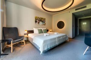 Posteľ alebo postele v izbe v ubytovaní Lyra Hotel Plitvice