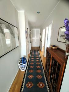 a hallway with a rug on the floor at Blue Dream in Portovenere