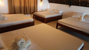 Postel nebo postele na pokoji v ubytování Villa Laetisha Beach Resort