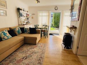 a living room with a couch and a table at The Corner Lodge in Portland