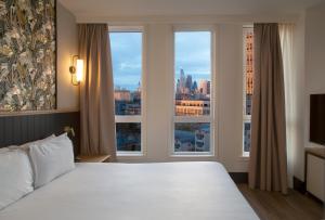Postel nebo postele na pokoji v ubytování H10 London Waterloo