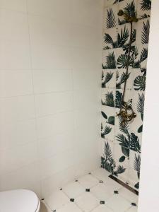 a bathroom with a toilet and a tile floor at Luxury Park Villa in Sandanski +40 photos