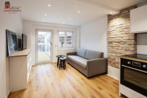 a living room with a couch and a table at Altstadt Apartments in Schongau