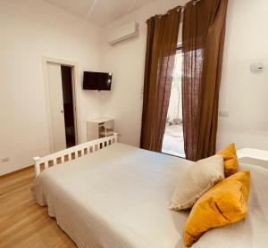 a bedroom with two beds and a window at La Titina Sella in Bari +24 photos