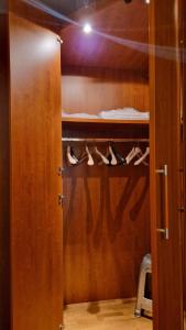 a door to a closet with shoes on it at Appartamento da Greta in Santa Maria degli Angeli