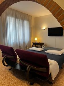 Postel nebo postele na pokoji v ubytování Locazione Turistica Joyful Padova