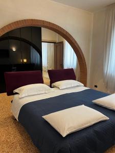 Postel nebo postele na pokoji v ubytování Locazione Turistica Joyful Padova
