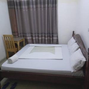 Ένα ή περισσότερα κρεβάτια σε δωμάτιο στο Angelina guest house