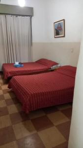 Postel nebo postele na pokoji v ubytování Hotel Florentino