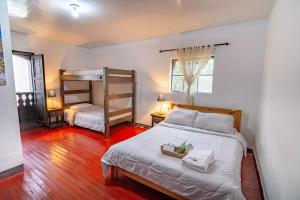 Ένα ή περισσότερα κρεβάτια σε δωμάτιο στο Hotel Casa del Colibri