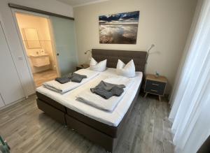 Postel nebo postele na pokoji v ubytování Nordsee Park Dangast Haus 6 Whg. 2 Strandläufer