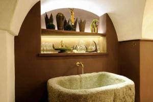 a bathroom with a bath tub in a room at Der Alpenhof Maria Alm in Maria Alm am Steinernen Meer